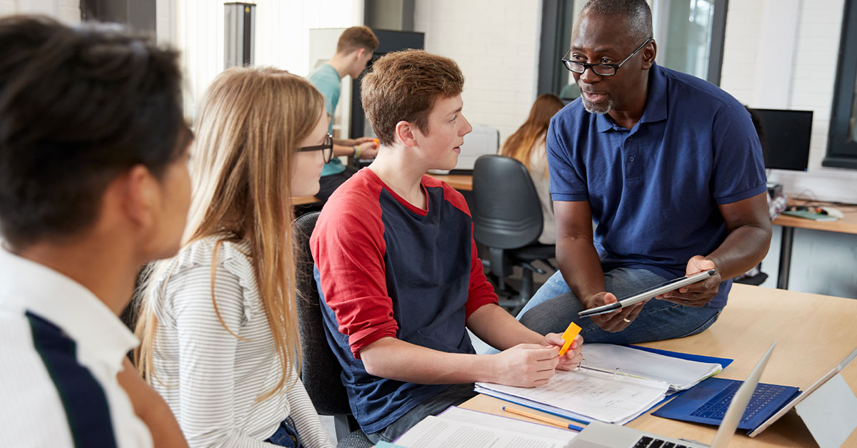 Students in classroom with teacher.