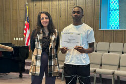 Damir Walter holding a certificate standing next to mentor.