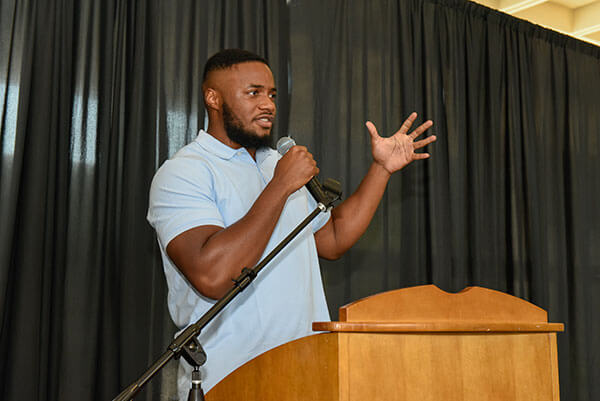 Ifeanyi Nwanoro speaking at podium